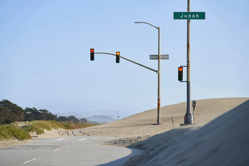 Great Highway roadway on San Francisco coast blocked by sand.